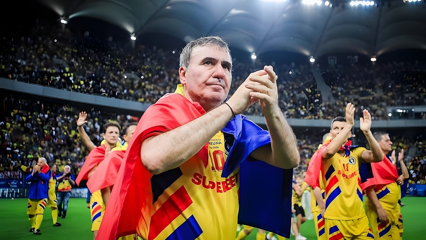 Gheorghe Hagi, Maradona din Carpați, aplaudă pe stadion, înfășurat în drapelul României, alături de jucători, după un meci al echipei naționale.